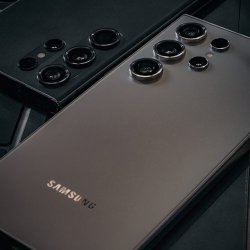 Photo by Bobby Raj Sirimani a close up of a cell phone near a keyboard