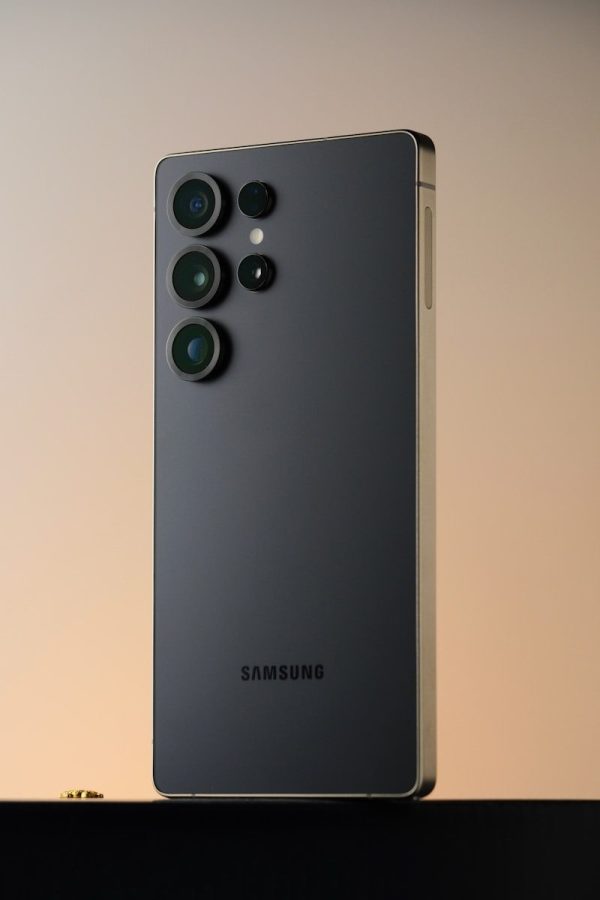 A dark gray samsung smartphone with multiple camera lenses.